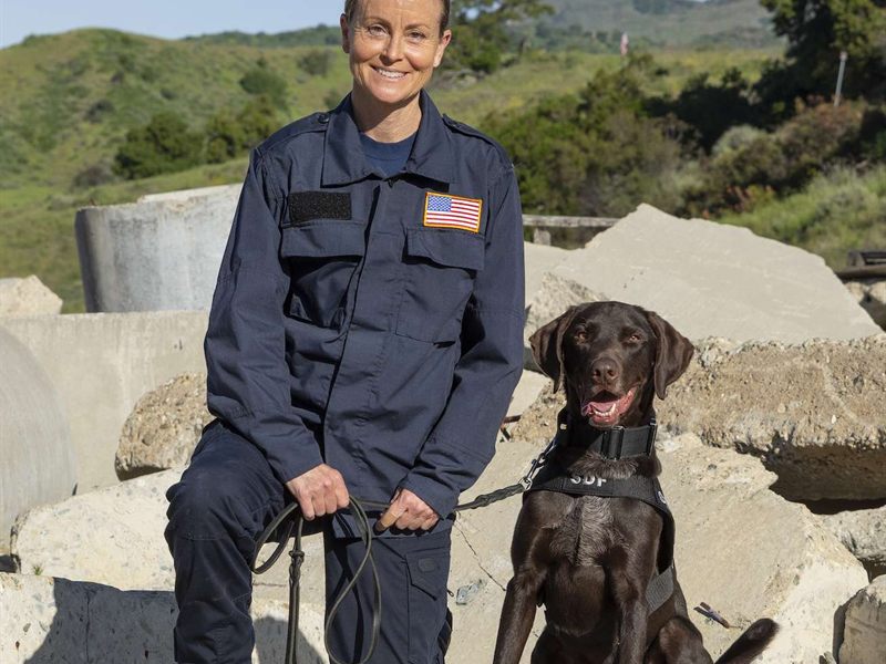 Search Dog Lennie with handler Alma Lowry on a rubble training pile